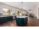 Spacious, remodeled kitchen open to the living room with granite countertops and stainless appliances at 3132 E Wildwood Dr, Phoenix, AZ 85048