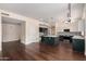 An open concept kitchen with granite countertops and stainless steel appliances at 3132 E Wildwood Dr, Phoenix, AZ 85048
