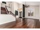 Open floorplan showing the staircase, entryway, and dark hardwood floors at 3132 E Wildwood Dr, Phoenix, AZ 85048