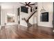 Expansive living room with staircase and dark wood floors at 3132 E Wildwood Dr, Phoenix, AZ 85048