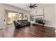 Comfortable living room featuring hardwood floors, fireplace, and a sliding glass door at 3132 E Wildwood Dr, Phoenix, AZ 85048