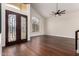 Spacious living area boasts high ceilings, dark hardwood floors, and large windows at 3132 E Wildwood Dr, Phoenix, AZ 85048