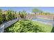 Enchanting backyard retreat featuring a lush turf area, a gated pool, and privacy landscaping for ultimate relaxation at 3310 E Los Gatos Dr, Phoenix, AZ 85050