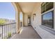 Spacious stucco balcony with neighborhood views through arched openings, a comfortable space for outdoor enjoyment at 3310 E Los Gatos Dr, Phoenix, AZ 85050