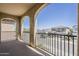 Balcony showcasing neighborhood views with stucco arches and iron railings, a private outdoor space for relaxation at 3310 E Los Gatos Dr, Phoenix, AZ 85050