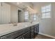 Bathroom boasting a dual sink vanity, large mirror, and modern lighting, creating a spa-like atmosphere at 3310 E Los Gatos Dr, Phoenix, AZ 85050