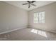 Comfortable bedroom with a ceiling fan and natural light streaming through the window, creating a cozy atmosphere at 3310 E Los Gatos Dr, Phoenix, AZ 85050