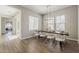 Modern dining area with hardwood floors, and views to the outdoor living spaces at 3310 E Los Gatos Dr, Phoenix, AZ 85050