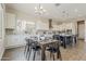 Open-concept dining area with modern décor, seamlessly connected to the kitchen at 3310 E Los Gatos Dr, Phoenix, AZ 85050
