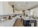 Spacious kitchen showcasing stainless appliances, white cabinets, granite countertops, and stylish fixtures at 3310 E Los Gatos Dr, Phoenix, AZ 85050