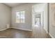 Spacious room with hardwood floors, lots of light and neutral colored paint at 3310 E Los Gatos Dr, Phoenix, AZ 85050