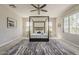 Stately main bedroom features natural light, a plush rug, and a four-poster bed at 3310 E Los Gatos Dr, Phoenix, AZ 85050