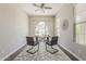 Well-lit office featuring stylish furniture, a ceiling fan, and wood-look flooring at 3310 E Los Gatos Dr, Phoenix, AZ 85050