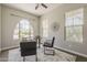 Comfortable office with a large arched window, modern decor and a ceiling fan at 3310 E Los Gatos Dr, Phoenix, AZ 85050