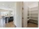 Open pantry filled with shelving conveniently located next to the kitchen at 3310 E Los Gatos Dr, Phoenix, AZ 85050