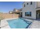 Inviting backyard pool with a tanning ledge, seamlessly blending relaxation and recreation at 3310 E Los Gatos Dr, Phoenix, AZ 85050