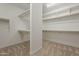 Spacious walk-in closet with ample shelving and carpeted floor at 3310 E Los Gatos Dr, Phoenix, AZ 85050