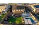 Bird's eye view of the property featuring a pool, playset, covered patio, and solar panels at 3715 W Teresa Dr, New River, AZ 85087