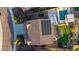 Aerial view of the property featuring a pool, sports court, solar panels, and spacious backyard at 3715 W Teresa Dr, New River, AZ 85087