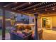 This backyard patio has a outdoor kitchen, fire pit, and comfortable seating at 3715 W Teresa Dr, New River, AZ 85087