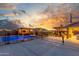 Stunning backyard oasis with a pool, sports court, and covered seating areas, perfect for entertaining at 3715 W Teresa Dr, New River, AZ 85087