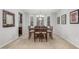 Elegant dining room with a chandelier, neutral carpet, and large windows for natural light at 3715 W Teresa Dr, New River, AZ 85087