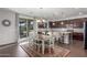 Inviting dining room open to the kitchen, featuring a stylish chandelier and access to the outdoor patio at 3715 W Teresa Dr, New River, AZ 85087