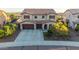 Beautiful two-story home with three-car garage, well-manicured landscaping, and a spacious driveway at 3715 W Teresa Dr, New River, AZ 85087
