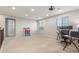 Spacious loft featuring neutral carpets, recessed lighting, work desks, and natural light from windows at 3715 W Teresa Dr, New River, AZ 85087