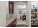 Galley featuring tiled backsplash, granite countertop, cabinetry, and pantry at 3715 W Teresa Dr, New River, AZ 85087