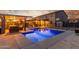 Backyard oasis with a sparkling blue pool, covered patio, and outdoor seating area at 3715 W Teresa Dr, New River, AZ 85087