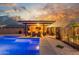 Backyard view showcasing a refreshing pool and covered patio with a cozy seating area at 3715 W Teresa Dr, New River, AZ 85087