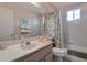 Cozy bathroom with tub and shower combination, vanity, and towel racks at 3755 N 151St Ave, Goodyear, AZ 85395