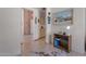 Hallway that leads to the kitchen features tile flooring and a hide rug at 3755 N 151St Ave, Goodyear, AZ 85395