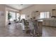 Well-lit kitchen featuring bar seating and a cozy breakfast nook for dining at 3755 N 151St Ave, Goodyear, AZ 85395