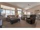 Bright living room boasting neutral tones, comfortable seating, and an open floor plan at 3755 N 151St Ave, Goodyear, AZ 85395