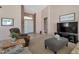 Comfortable living room featuring neutral colors, tall ceilings, and an open entry way at 3755 N 151St Ave, Goodyear, AZ 85395