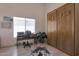 Bright office space with a built-in wardrobe and desk, and a hide rug at 3755 N 151St Ave, Goodyear, AZ 85395