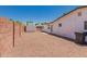 Fenced backyard featuring a storage shed, gravel, and mature landscaping at 39 N Maple St, Mesa, AZ 85205
