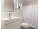 Modern bathroom featuring stylish vanity, new fixtures, and a shower with a curtain at 39 N Maple St, Mesa, AZ 85205