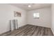 Bedroom with plank floors, ceiling fan, and neutral colors with ample natural light at 39 N Maple St, Mesa, AZ 85205