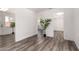 Open view of a bedroom with hard surface floors leading to the closet at 39 N Maple St, Mesa, AZ 85205