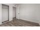 Well-lit bedroom with an open closet, hard surface floors and neutral paint at 39 N Maple St, Mesa, AZ 85205