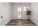 Bright bedroom with backyard access and new vinyl plank flooring, with ample natural light at 39 N Maple St, Mesa, AZ 85205