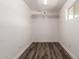 Large, walk-in closet with shelves, lighting, and hard surface flooring at 39 N Maple St, Mesa, AZ 85205