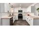 Bright modern kitchen with stainless steel appliances, light wood countertops, and a subway tile backsplash at 39 N Maple St, Mesa, AZ 85205