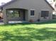 The backyard boasts a covered patio and manicured lawn, perfect for relaxing and entertaining at 4083 E Rustler Way, Gilbert, AZ 85297