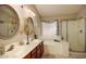 Bathroom with dual sinks, walk-in shower, and large soaking tub offers a spa-like retreat at 4083 E Rustler Way, Gilbert, AZ 85297