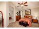Spacious bedroom boasts a ceiling fan, vaulted ceiling, and ensuite bathroom access at 4083 E Rustler Way, Gilbert, AZ 85297