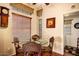 Cozy breakfast nook with wicker chairs, glass table, and lots of natural light at 4083 E Rustler Way, Gilbert, AZ 85297